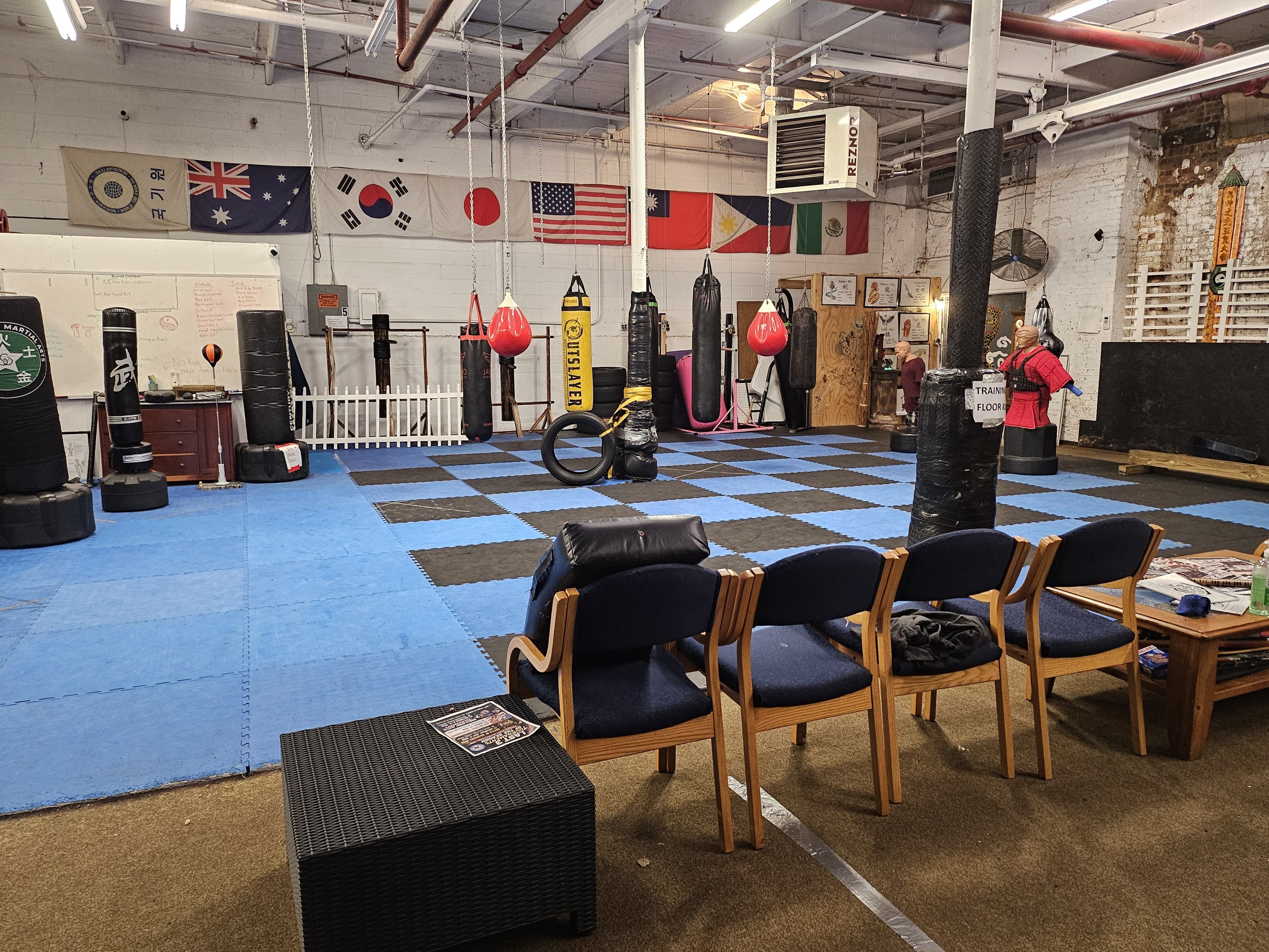The Cloud Forest training hall, wood floor and red uniforms