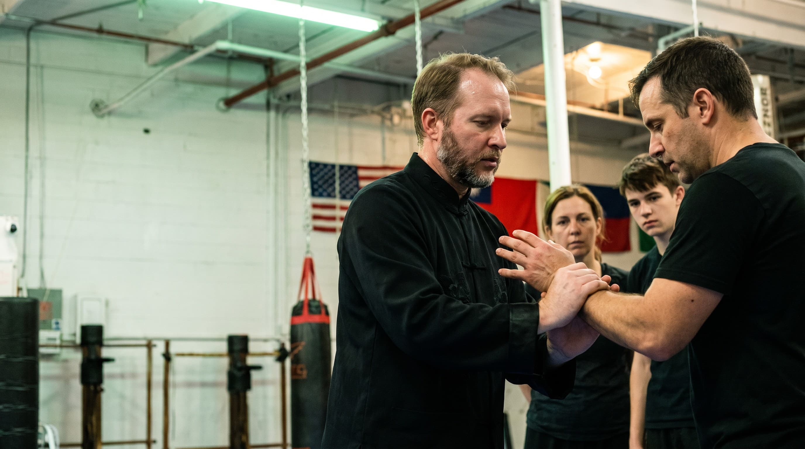 Sifu Michael Johnson teaching a close-range technique to a senior student